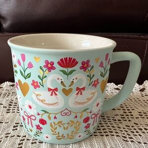 Clementine mug swans,and flowers. Has hand painted look. 12-14oz.